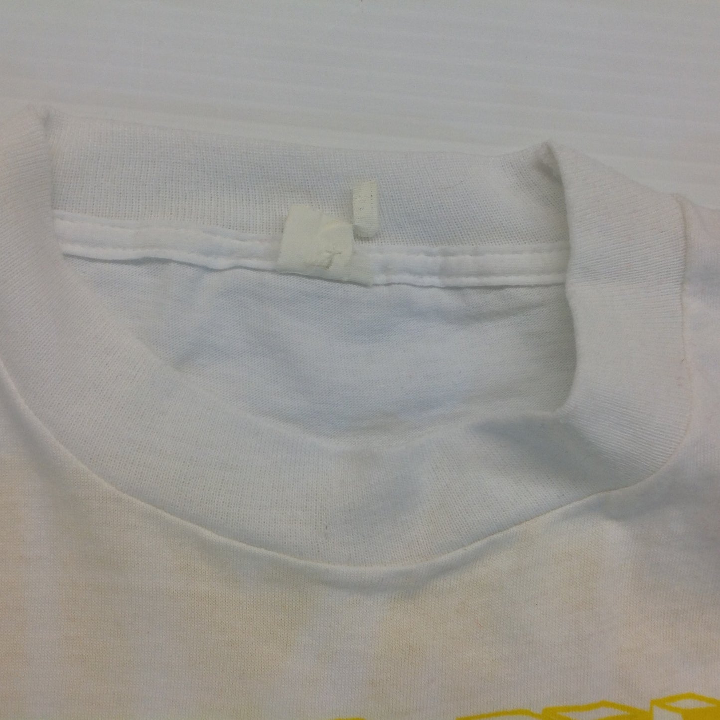 Vintage 1980's Novelty T-Shirt STAYING ALIVE IN 85 Yellow on White Katharine Hamnett