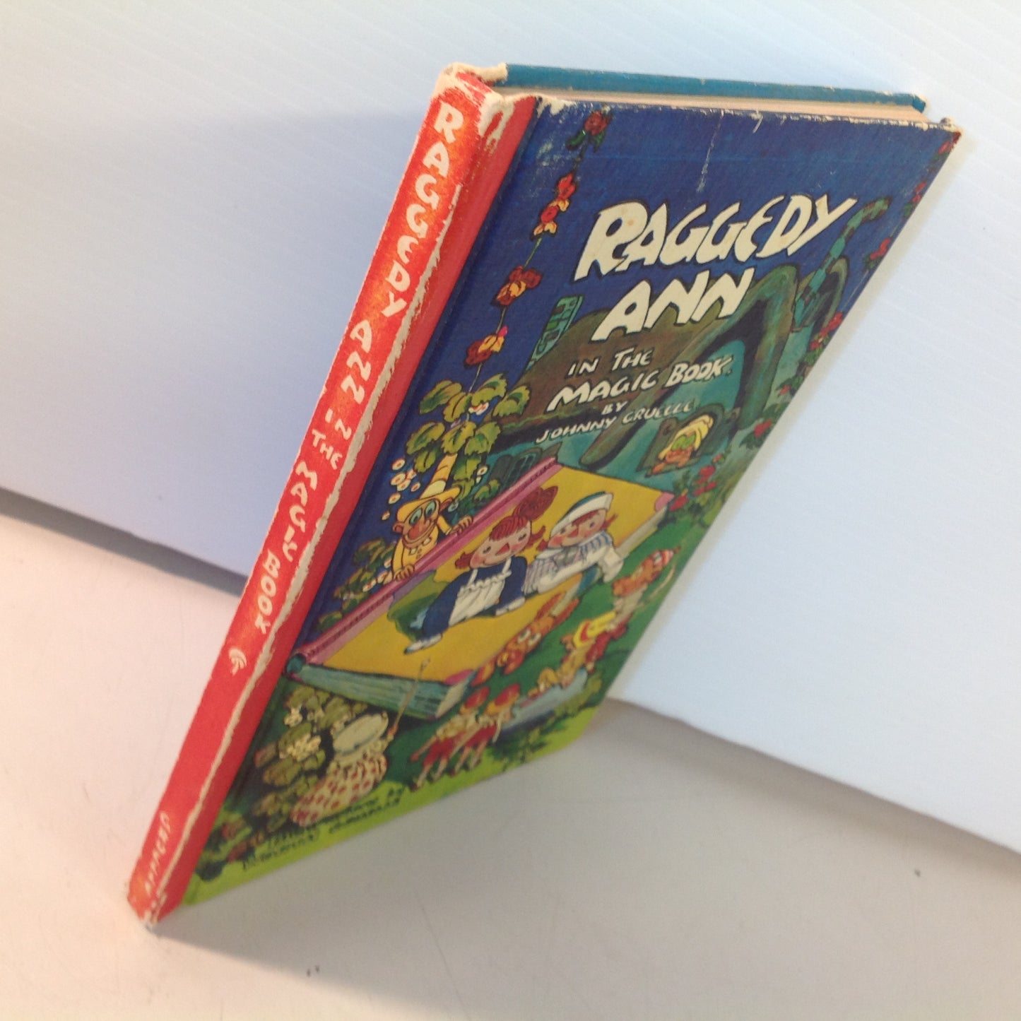 Vintage 1960 Bobbs-Merrill Hardcover Book Raggedy Ann In the Magic Book by Johnny Gruelle