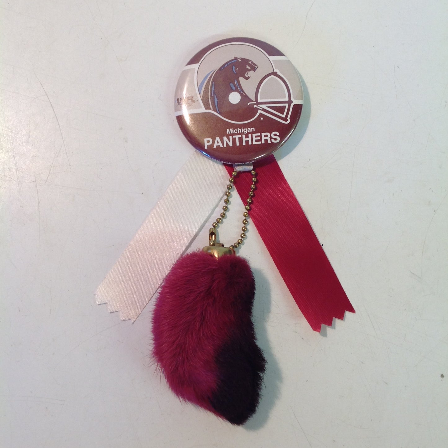 Vintage Michigan Panthers USFL Football Team Pinback with Ribbon and Maroon Rabbit Foot Flair