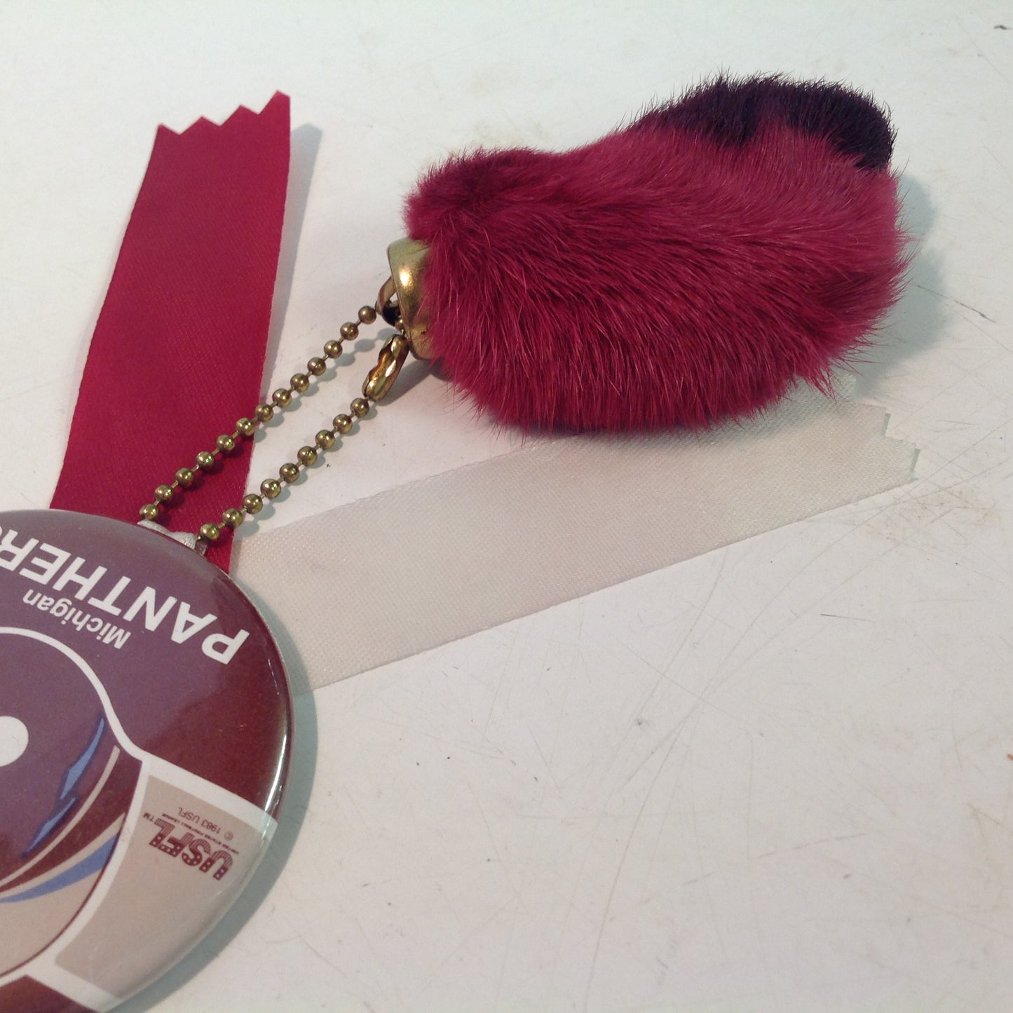 Vintage Michigan Panthers USFL Football Team Pinback with Ribbon and Maroon Rabbit Foot Flair