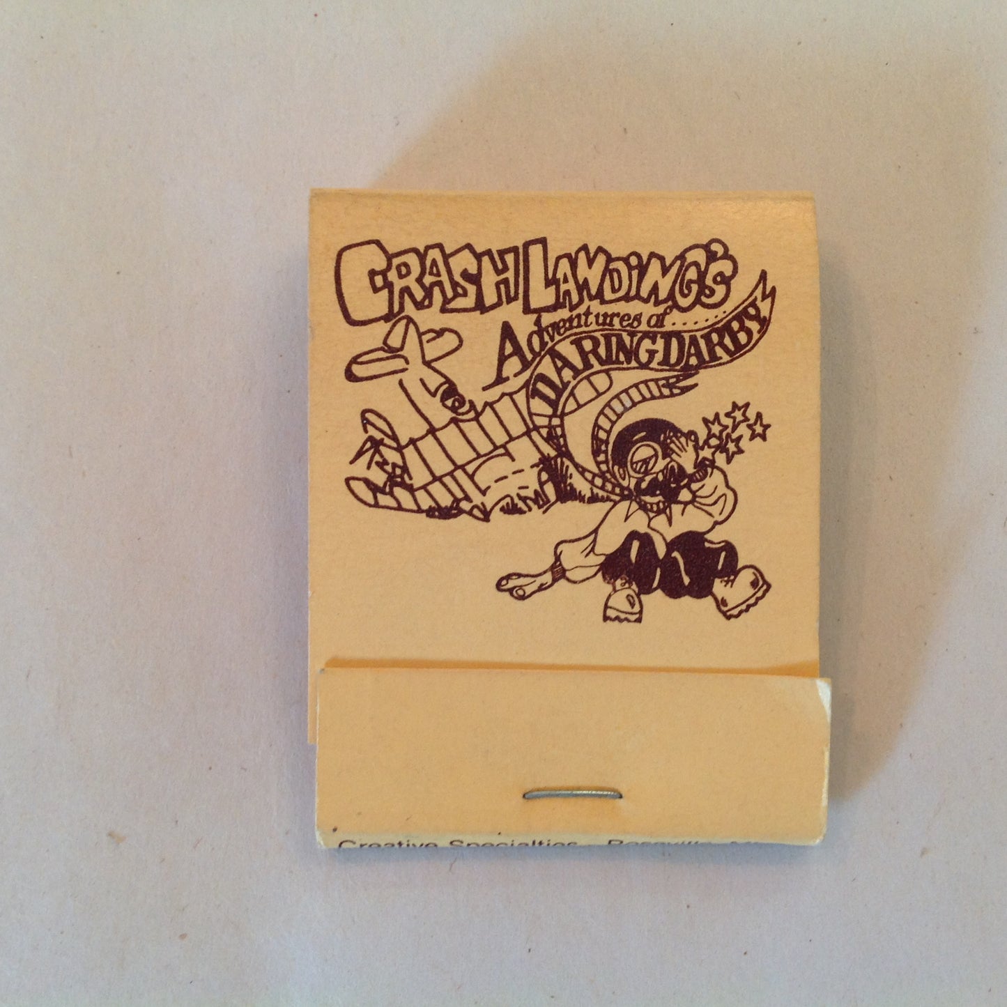Vintage Souvenir Matchbook Crash Landing's Adventures of Daring Darby Warren MI