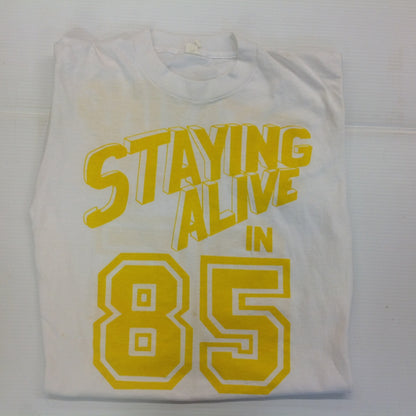 Vintage 1980's Novelty T-Shirt STAYING ALIVE IN 85 Yellow on White Katharine Hamnett