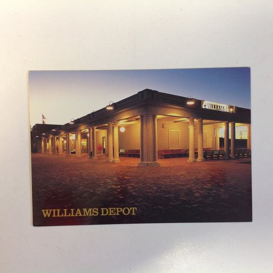 Vintage Color Postcard Ron Behrmann Photo Williams Depot and Fray Marcos Hotel in Evening Shadows Grand Canyon Railway Williams Arizona